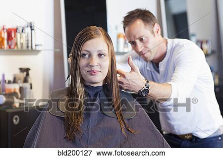 Stock Photo - Woman having haircut in salon. Fotosearch