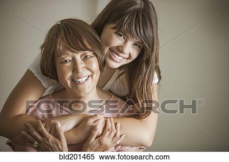 Woman hugging grandmother View Large Photo Image Stock Photography - Woman hugging grandmother. Fotosearch