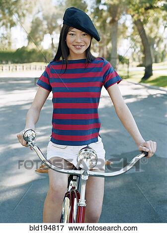 Woman riding bicycle with beret View Large Photo Image Stock Photo - Woman riding bicycle with beret. Fotosearch