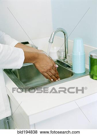 Woman washing hands View Large Photo Image Stock Photo - Woman washing hands. Fotosearch