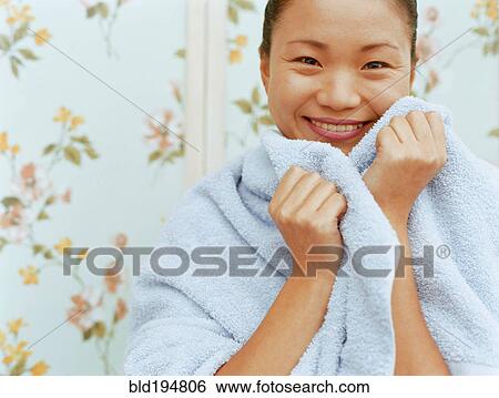 Woman wrapped in towel View Large Photo Image Stock Photograph - Woman wrapped in towel. Fotosearch