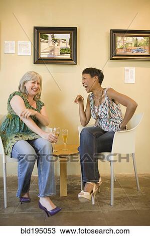 Women in gallery drinking champagne View Large Photo Image Stock Image - Women in gallery drinking champagne. Fotosearch