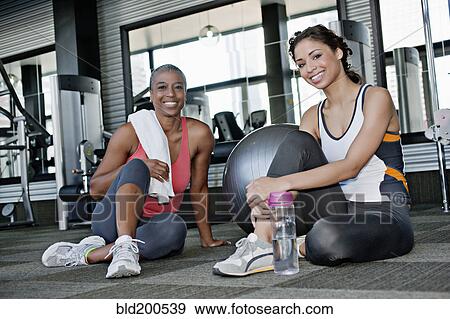Stock Photo - Women sitting together in health club. Fotosearch