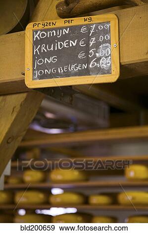 Stock Photo - Wooden sign for cheese prices. Fotosearch