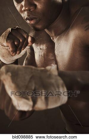 Stock Photography - African American boxer training. Fotosearch