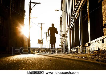 Stock Image - African American man jogging. Fotosearch