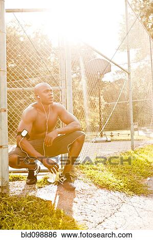 African American man relaxing after exercise View Large Photo Image Stock Photograph - African American man relaxing after exercise. Fotosearch