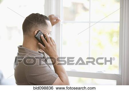 Stock Photograph - Black man talking on cell phone. Fotosearch