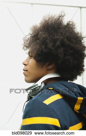 Black man with headphones around neck View Large Photo Image Stock Photo - Black man with headphones around neck. Fotosearch