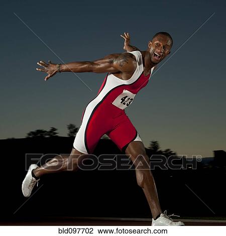 Black runner crossing finish line in race View Large Photo Image Stock Image - Black runner crossing finish line in race. Fotosearch