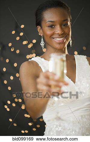 Stock Photo - Black woman drinking Champagne. Fotosearch