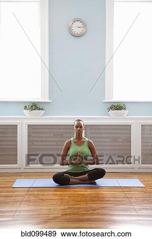 Black woman practicing yoga View Large Photo Image Stock Photo - Black woman practicing yoga. Fotosearch
