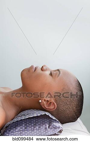 Picture - Black woman waiting for spa treatment. Fotosearch