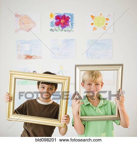 Boys looking through empty frames View Large Photo Image Stock Image - Boys looking through empty frames. Fotosearch