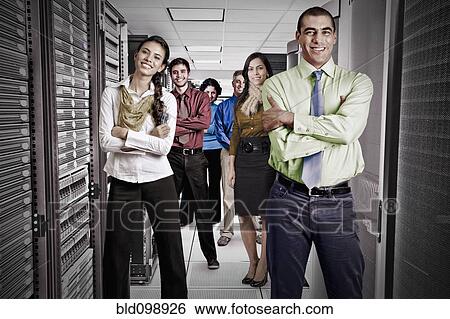 Stock Photograph - Business people standing together in server room. Fotosearch