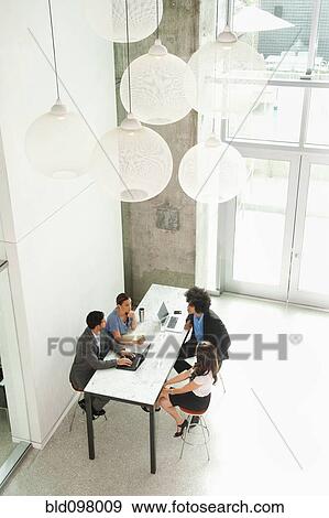 Business people working together in office View Large Photo Image Stock Photo - Business people working together in office. Fotosearch