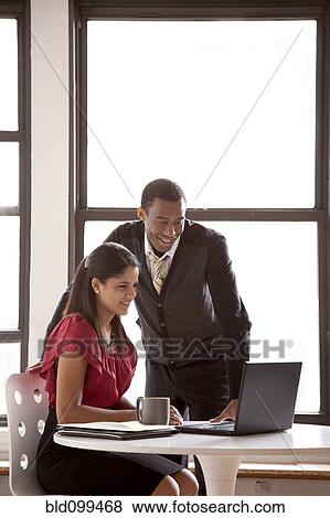 Business people working together in office View Large Photo Image Stock Photo - Business people working together in office. Fotosearch