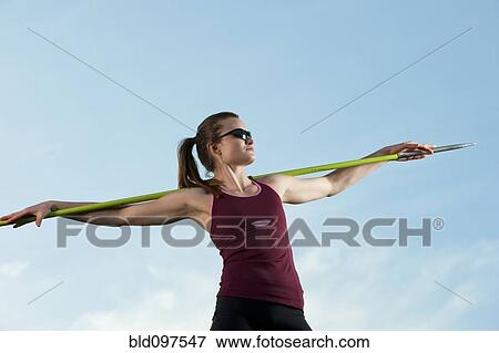 Caucasian athlete holding javelin View Large Photo Image Stock Photo - Caucasian athlete holding javelin. Fotosearch