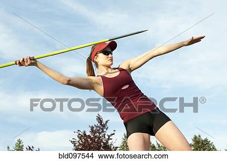 Picture - Caucasian athlete throwing javelin. Fotosearch