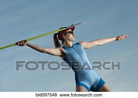 Caucasian athlete throwing javelin View Large Photo Image Stock Photo - Caucasian athlete throwing javelin. Fotosearch