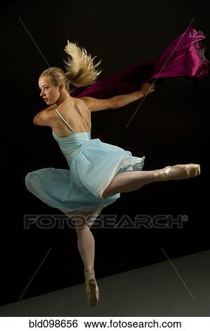 Stock Photograph - Caucasian ballet dancer in mid-air. Fotosearch