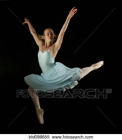 Caucasian ballet dancer in mid-air View Large Photo Image Stock Photography - Caucasian ballet dancer in mid-air. Fotosearch