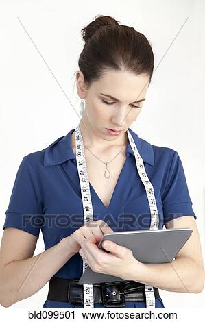 Caucasian businesswoman using digital tablet View Large Photo Image Stock Image - Caucasian businesswoman using digital tablet. Fotosearch