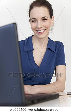Caucasian businesswoman using laptop View Large Photo Image Stock Image - Caucasian businesswoman using laptop. Fotosearch