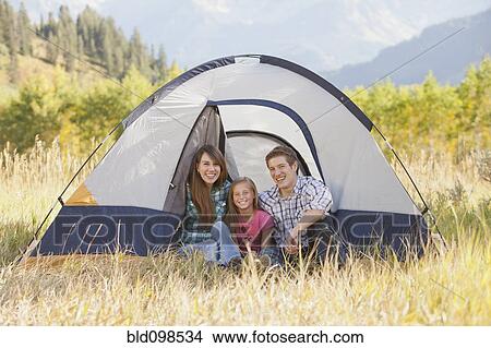 Picture - Caucasian family camping together. Fotosearch