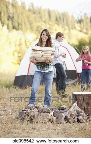 Stock Image - Caucasian family camping together. Fotosearch