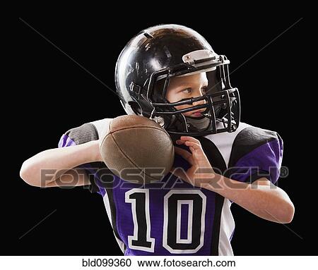 Caucasian football player throwing football View Large Photo Image Stock Image - Caucasian football player throwing football. Fotosearch