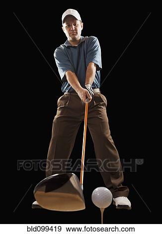 Caucasian golfer about to hit golf ball View Large Photo Image Stock Photo - Caucasian golfer about to hit golf ball. Fotosearch