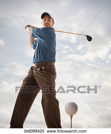 Caucasian golfer about to swing golf club View Large Photo Image Stock Photography - Caucasian golfer about to swing golf club. Fotosearch