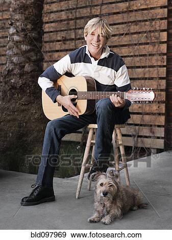 Caucasian man playing guitar View Large Photo Image Stock Photo - Caucasian man playing guitar. Fotosearch