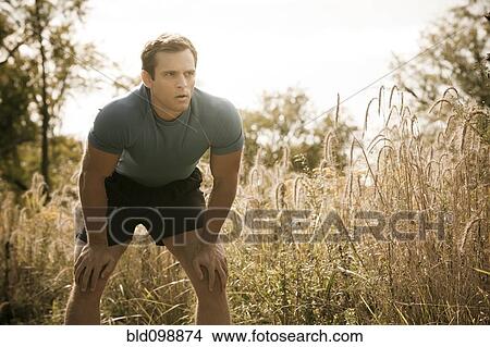 Caucasian man relaxing after exercise View Large Photo Image Picture - Caucasian man relaxing after exercise. Fotosearch