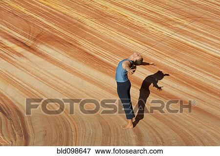Caucasian woman practicing yoga outdoors View Large Photo Image Stock Photo - Caucasian woman practicing yoga outdoors. Fotosearch