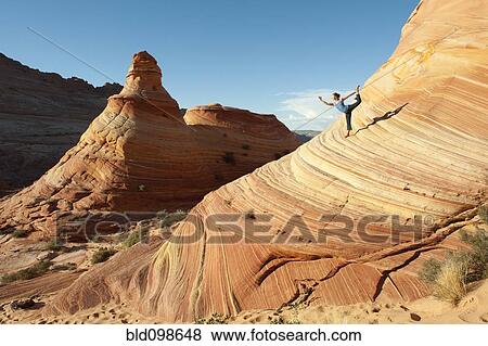 Stock Photo - Caucasian woman practicing yoga outdoors. Fotosearch