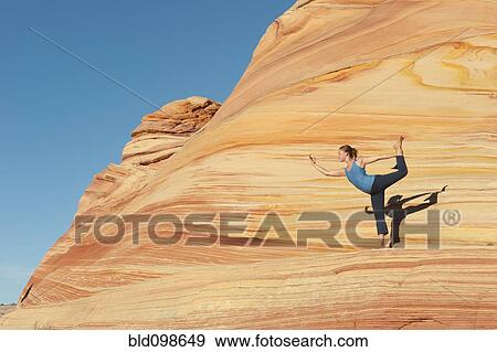 Caucasian woman practicing yoga outdoors View Large Photo Image Stock Photo - Caucasian woman practicing yoga outdoors. Fotosearch