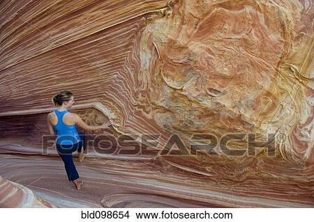 Caucasian woman standing near rock formation View Large Photo Image Picture - Caucasian woman standing near rock formation. Fotosearch