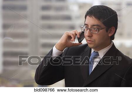 Stock Photograph - Chilean businessman talking on cell phone. Fotosearch