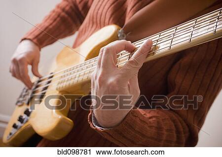 Stock Image - Chilean man playing guitar. Fotosearch