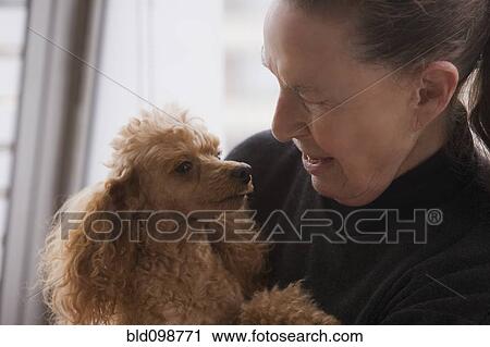Chilean woman hugging dog View Large Photo Image Stock Image - Chilean woman hugging dog. Fotosearch