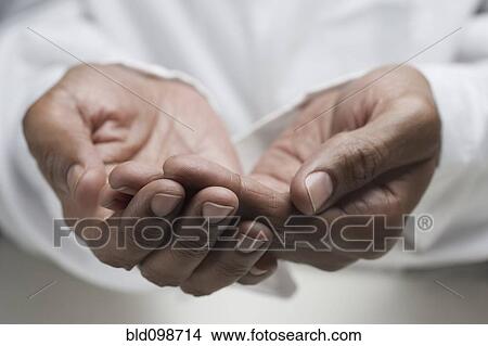 Close up of mixed race man's hands View Large Photo Image Picture - Close up of mixed race man's hands. Fotosearch