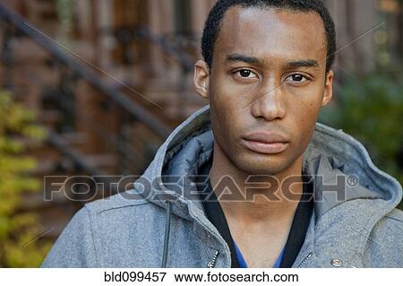 Close up of serious Black man View Large Photo Image Stock Photo - Close up of serious Black man. Fotosearch