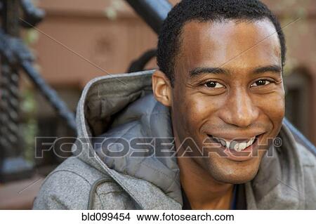 Picture - Close up of smiling Black man. Fotosearch