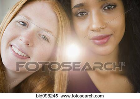 Stock Photography - Close up of smiling friends. Fotosearch