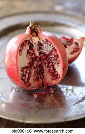 Stock Image - Cut open pomegranate. Fotosearch