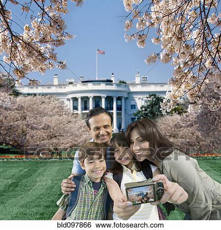 Stock Photograph - Family taking self-portrait near the White House. Fotosearch
