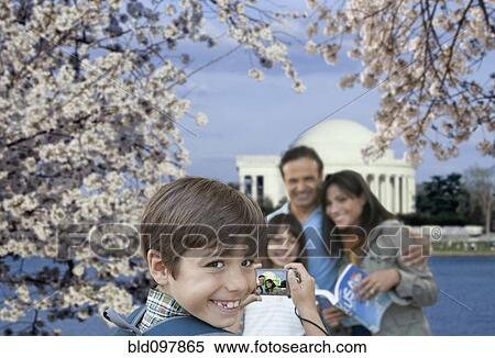 Stock Photography - Family taking vacation picture near the Jefferson Memorial. Fotosearch