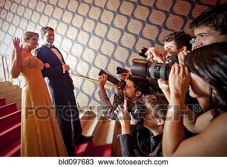 Stock Image - Famous Hispanic couple posing for press photographers. Fotosearch